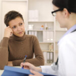 Health care professional with patient